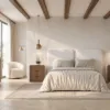 Dormitorio contemporáneo con cama de cabecero tapizado curvo, mesillas de madera con cantos redondeados, cómoda o consola a juego, espejo ovalado iluminado y decoración en tonos naturales